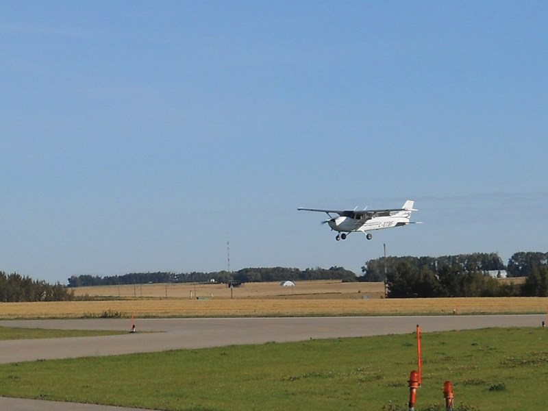 A plane comes into land at the Olds-Didsbury airport.