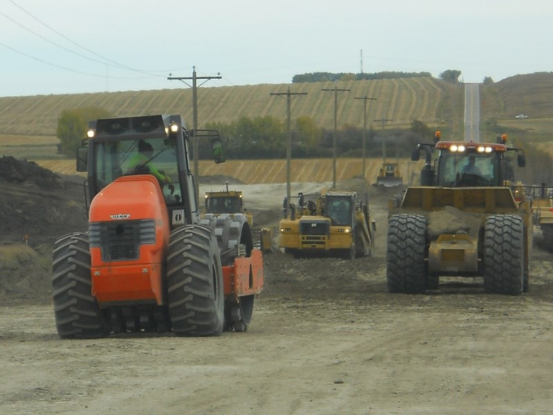 Crews get the job done on Acme Road.