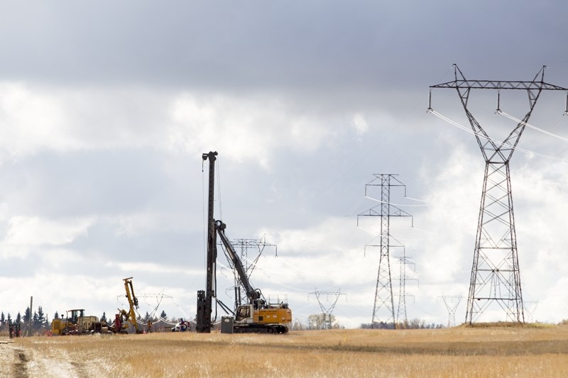 Pipeline workers on the job north of Olds