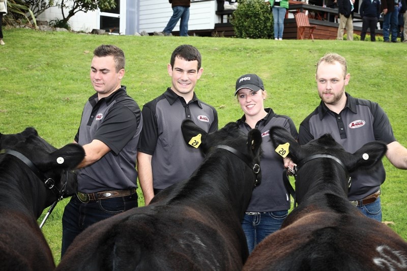 World champions pose with cattle.