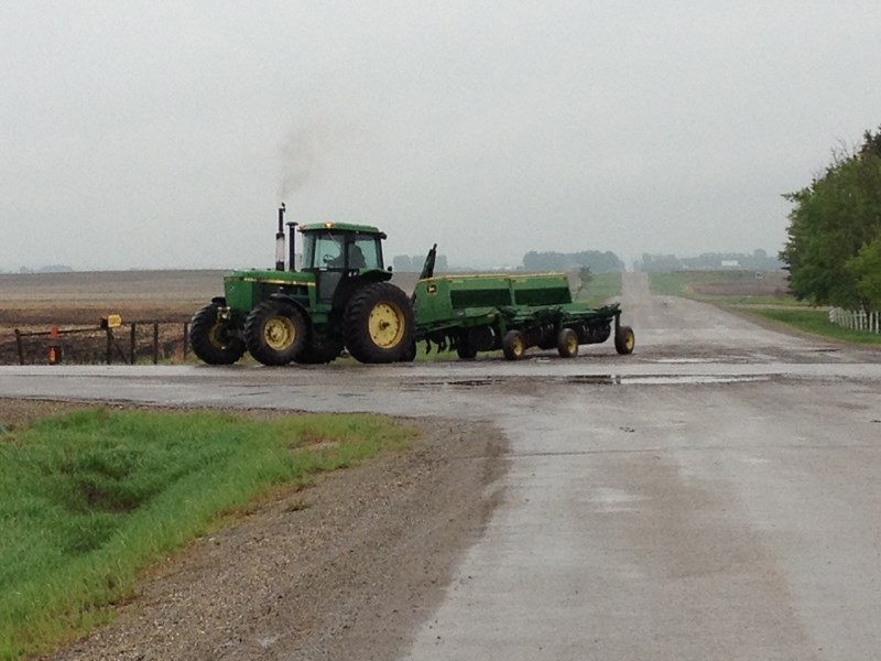 A farm vehicle turns off the Bergen Road west of Highway 2A