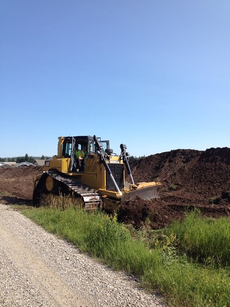 Crews widen the road for the new Sundre lodge