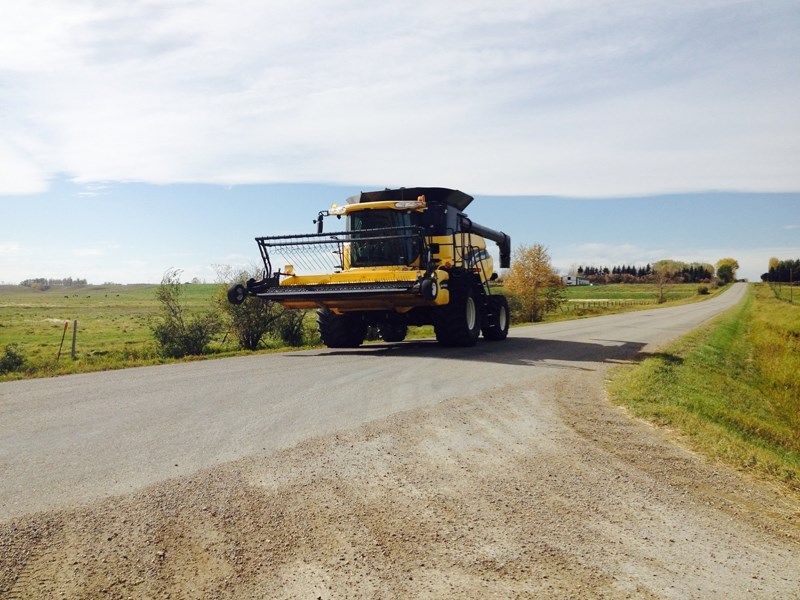 Farm equipment moves on Bergen Road.