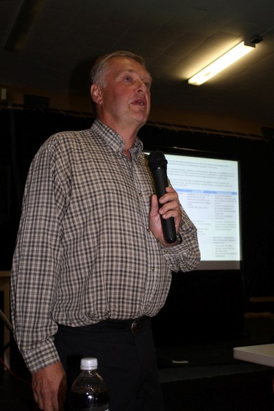 David Wells speaks at meeting