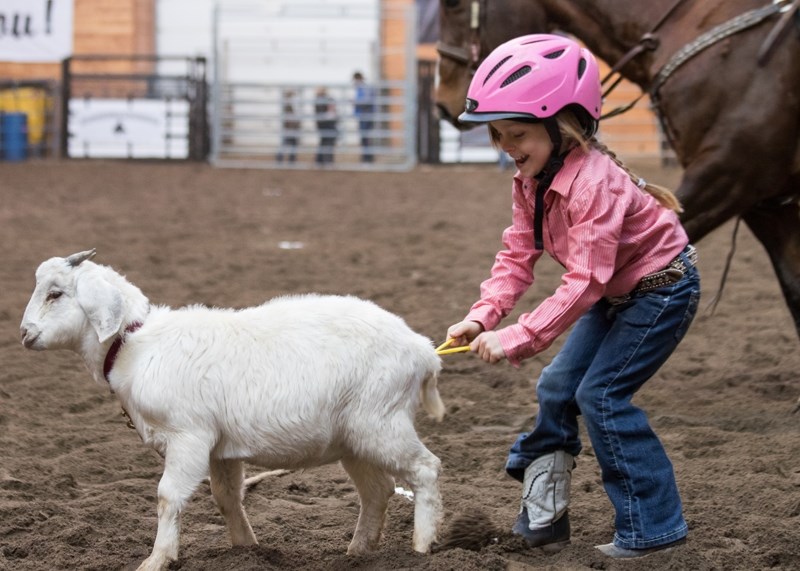 Ellie Havens is all smiles as she competes in the goat tying event at the recent rodeo.