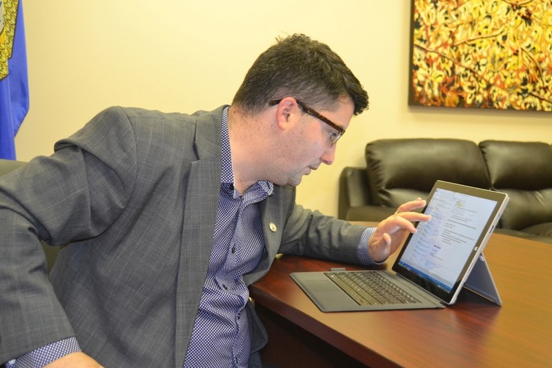 Olds-Didsbury-Three Hills MLA Nathan Cooper researches information regarding the provincial government.