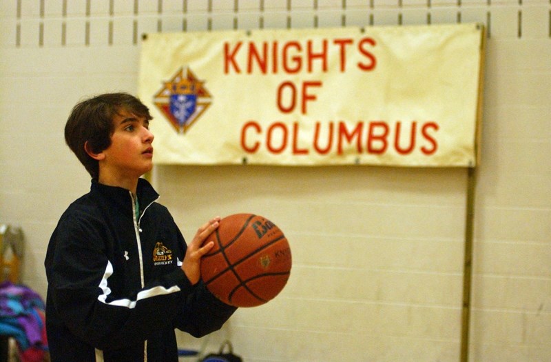 Olds&#8217; Logan Richards prepares to shoot at the Knights of Columbus Free Throw Championship at Holy Trinity Catholic School in Olds on Feb. 20. The 13-year-old made eight 