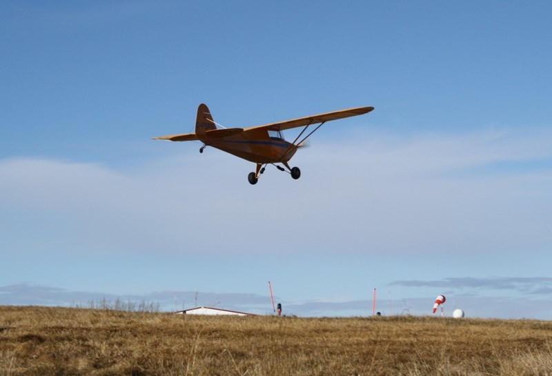 A small plane comes in to land at the Olds-Didsbury Airport. The facility will be hosting a fly-in and auto show in June.