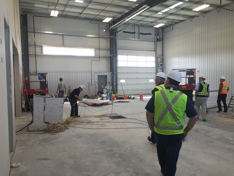 Mountain View County councillors Jeremy Sayer and Duncan Milne tour the new agriculture lands and parks services shop last week. The $2.3-million facility is nearing