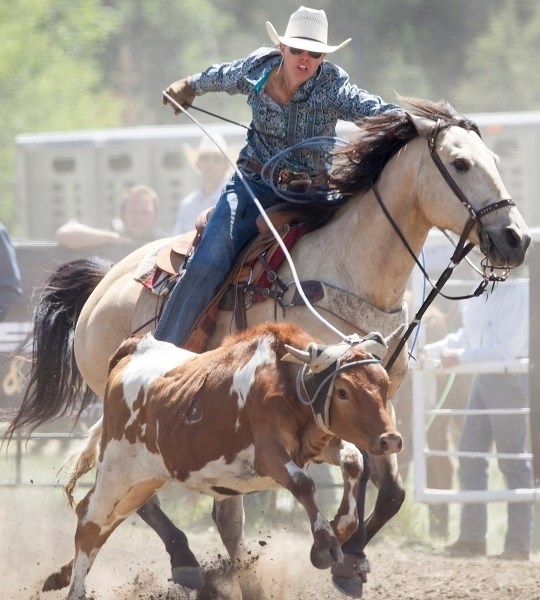 Cassie Robinson gets her rope around a steer during the team roping event at the 63rd annual Water Valley rodeo west of Water Valley on June 5.