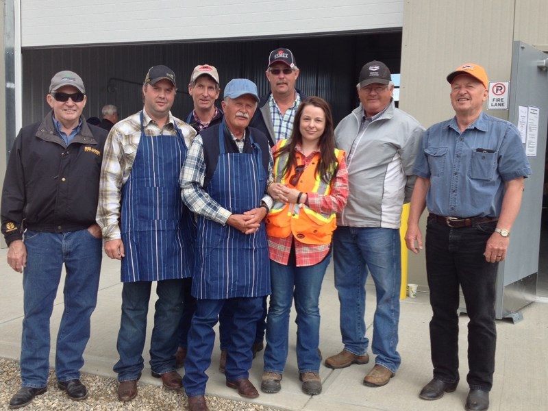 Members of the Mountain View County agricultural service board, staff and Reeve Bruce Beattie pose for a photo outside the newly-opened agriculture lands and parks services