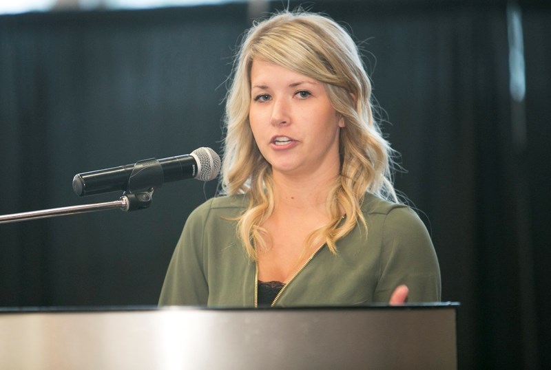 Katelyn Hudgeon, a student with the Campus Alberta Central (CAC) joint venture between Olds College and Red Deer College speaks at a ceremony on June 21.