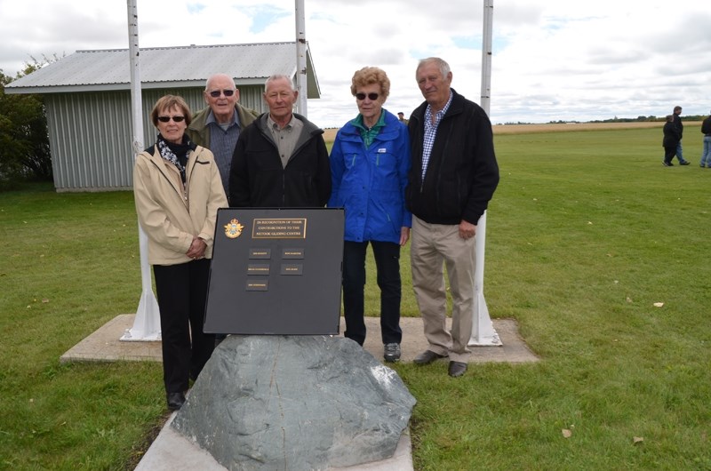 Norma Steffensen, Ross Hamilton, Neil Olsen, and Marrion and Don Bennetta stand beside a cairn dedicated to those who played a significant role in the acquisition and