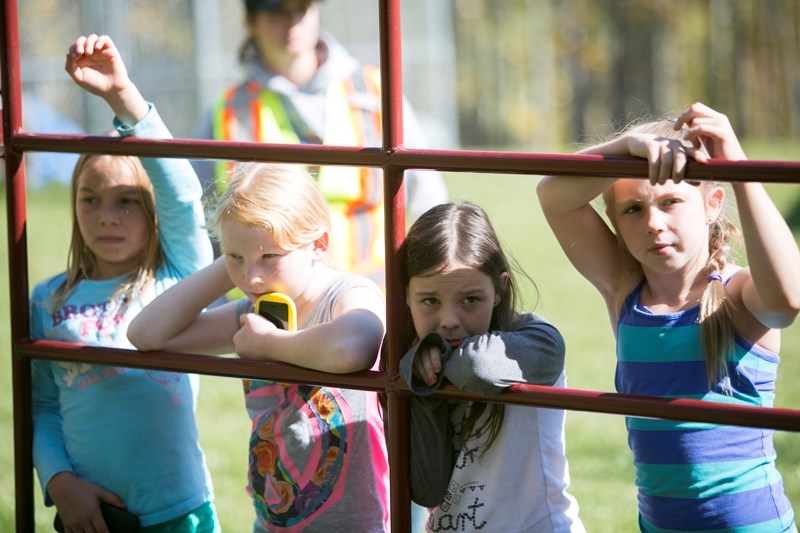 From left to right &#8211; Ecole Olds Elementary School students Megan Hanna, Katja Jordet-Rinsma, Chloe Hunt and Peyton Cheek learn about safety around dairy cows at the