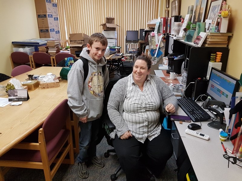 Rachel Verhaeghe, children&#8217;s programmer for the Didsbury Municipal Library and son Caius share a smile in the facility on Nov. 8.