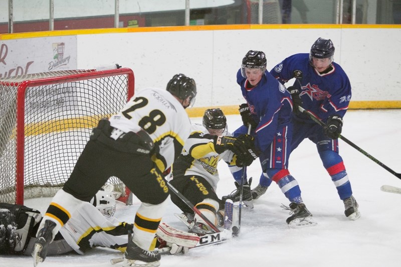 Mountainview Colts player Mitchell Visser puts pressue on the Strathmore Wheatland Kings goaltender during the teams&#8217; game at the Didsbury Memorial Arena on Nov. 19.