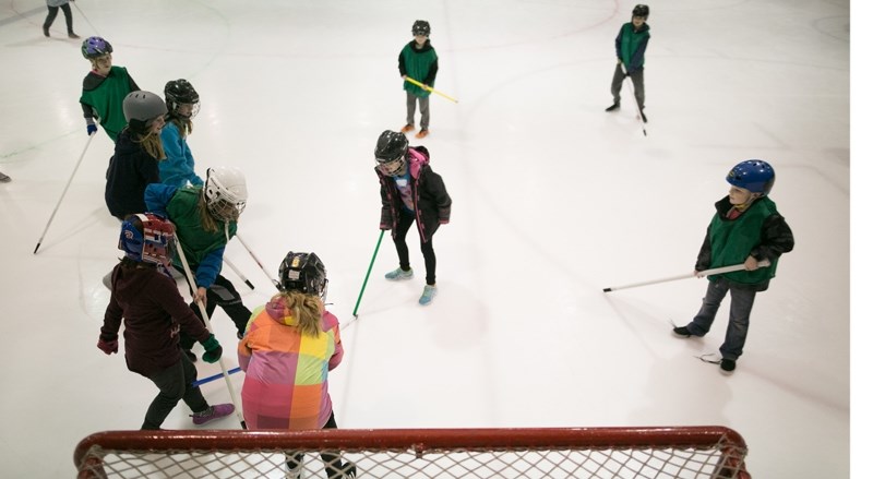 Hugh Sutherland School students play ringette during an Olympics event at the Carstairs Memorial Arena on Feb. 16.