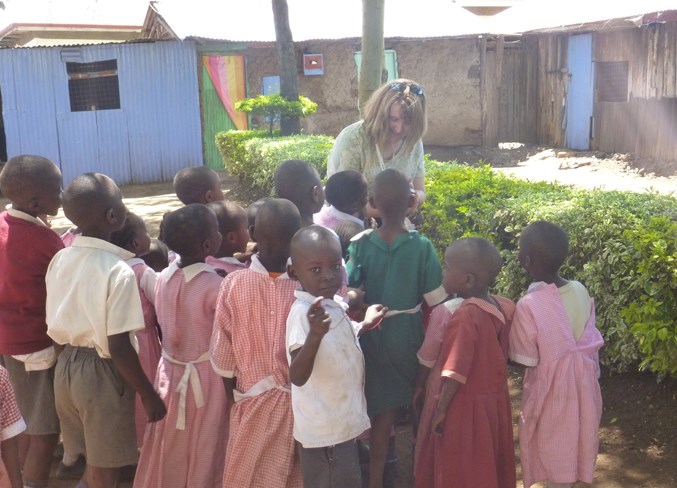 Didsbury&#8217;s Cathy Jackson visits with kids from the African town of Roret.