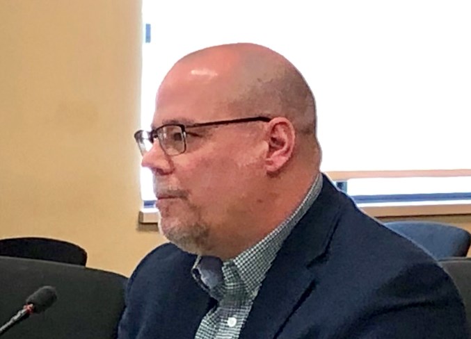 Patrick Machacek speaks with councillors on March 27.