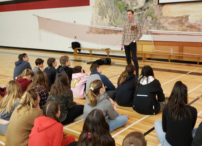 Dustin Hogan talks to Grade 8 students at Westglen School about online safety.