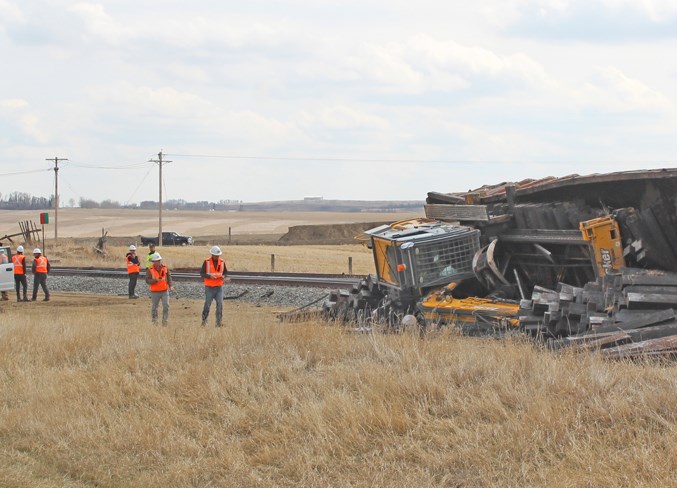 Crews work at the scene of a rail derailment outside Carstairs on May 6.