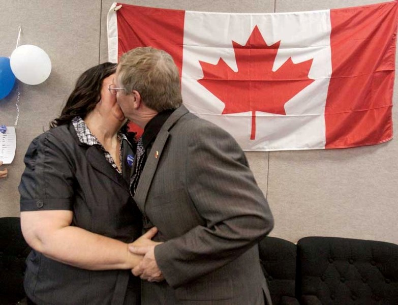 Red Deer MP Earl Dreeshen, who was re-elected in the Red Deer riding Monday night, gives his wife Judy a celebratory kiss.