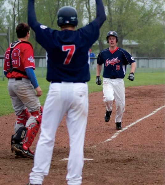 Triston Cunningham scores during the Indians May 25 game against Eckville.