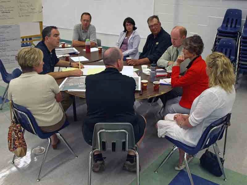 Gordon McIntosh (left), of LGL Institute, leads a panel discussion at last week&#8217;s community workshop into the revitalization of the downtown core.