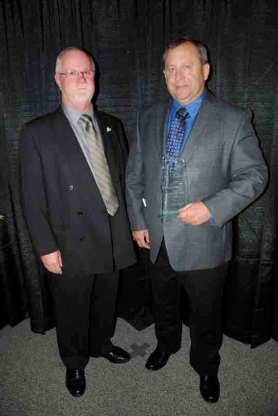 Citizen of the year Brian Spiller (right) poses with Innisfail Mayor Jim Romane at the Gala Awards Evening on Oct. 14.