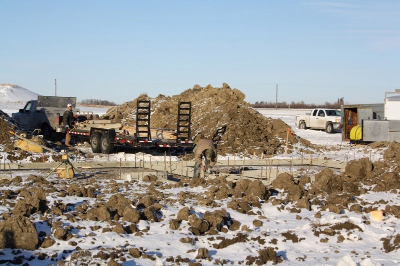 Crews work on the foundation of a home west of the Penhold Multiplex last Wednesday, Dec. 21. Penhold saw a record number of homes built in the town&#8217;s history in 2011