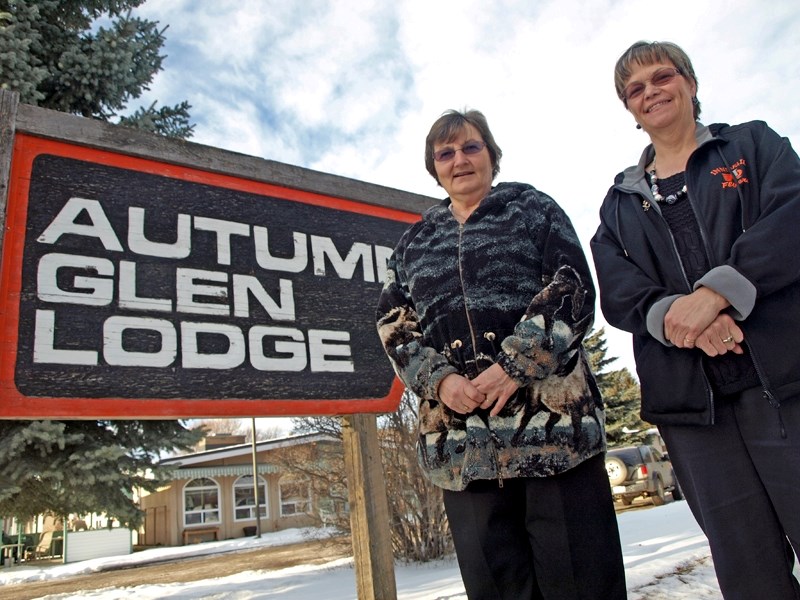 Autumn Glen Lodge Manager Karen Marshall (left) stands with Marie Flowers, chief administrative officer of the Parkland Foundation, outside the half-century-old seniors home. 