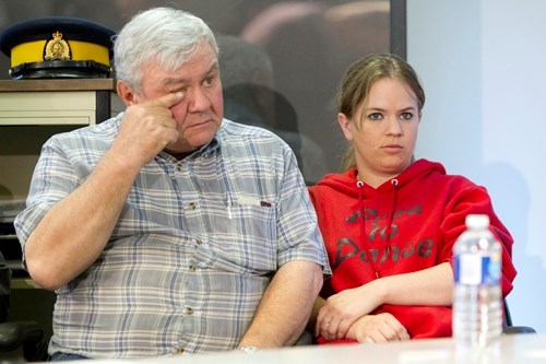 Vicky Shachtay&#8217;s father Victor wipes a tear from his eye as he and his daughter Sarah speak to the press after a RCMP news conference at the Innisfail detachment on May 