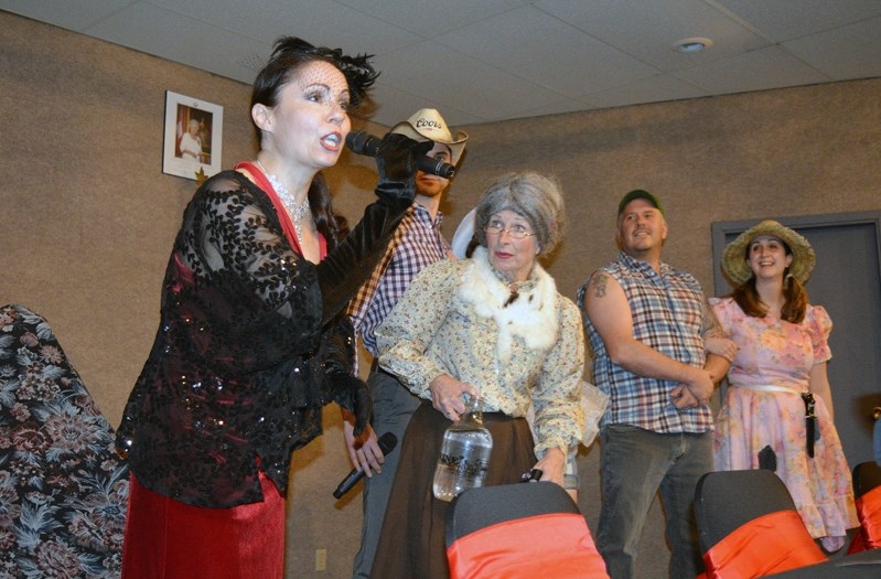 Members of the cast with Terry Shane Murder Mysteries of Smoking Gun Entertainment perform a scene from Tying the Knot: A Hillbilly Wedding at the Innisfail Royal Canadian