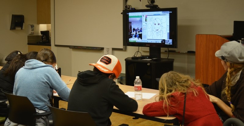 Participants of all ages learned to draw Japanese Manga and Anime characters during a live teleconference from Japan at the Family Literacy Festival on Jan. 27.