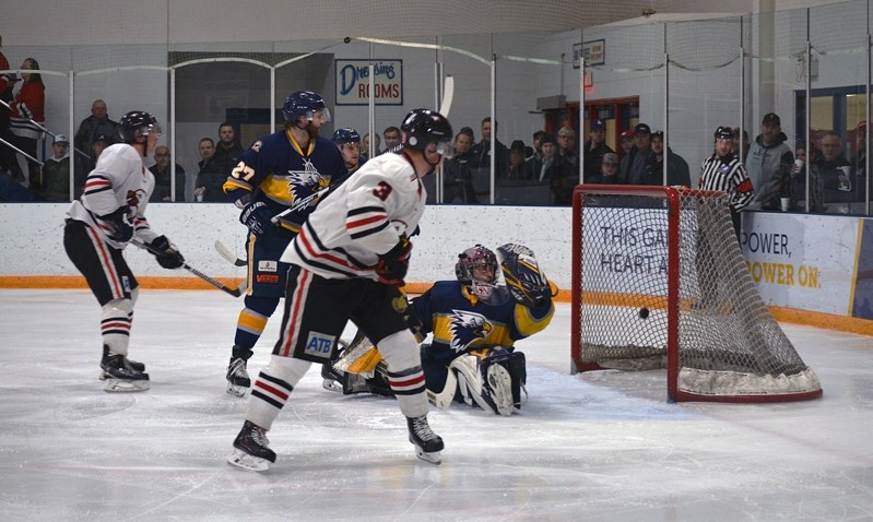 Zach Franko (#3) finds the back of the net, giving the Innisfail Eagles a two-goal lead at 3-1 early in the second period of the sixth game of the Chinook Hockey League semi