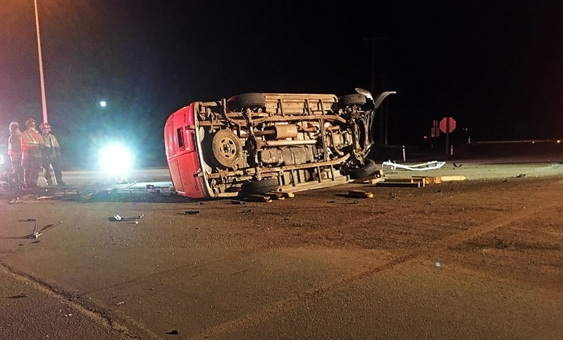 A van is on its side at the intersection of highways 2A and 42 following a deadly two-vehicle crash early in the morning on March 3.