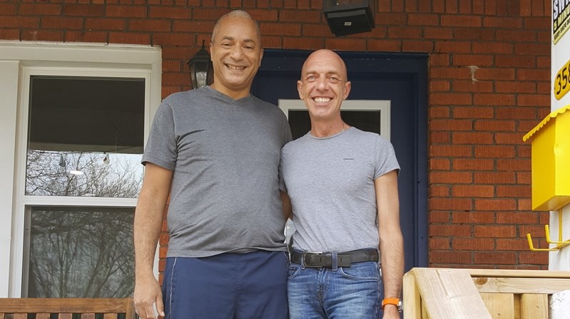 Michael Potter (right) and his husband Matthew Allsopp in front of their home in Windsor, Ont. Potter was born in Olds, before becoming a resident of Innisfail for 11 years,