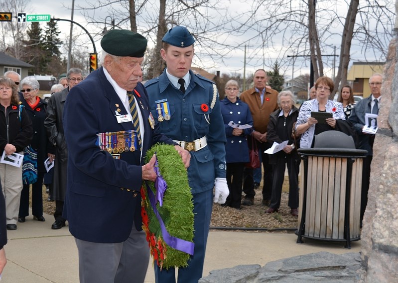 Doug Whorrall, a Korean War vet, lays a wreath at the Innisfail cenotaph during a commemorative service marking the 100th anniversary of the Battle of Vimy Ridge on April 9.