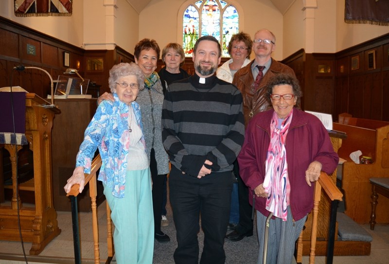 Parishioners at St. Mark&#8217;s Anglican Church will join Rev. Chris Roth, centre, in celebrating the church&#8217;s 125th anniversary on April 30. The congregation will