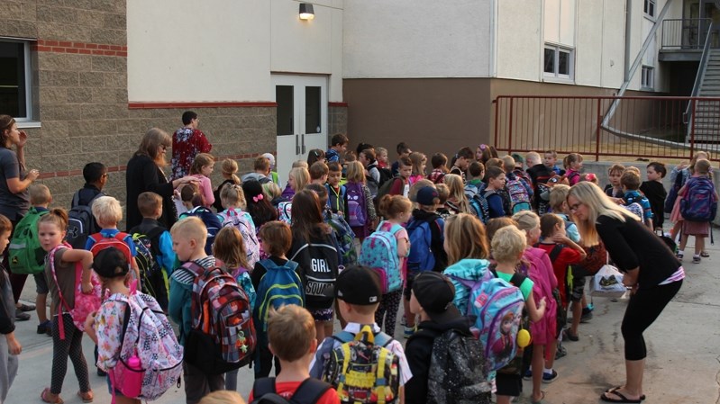 More than 500 students line up for the first day back to school at école John Wilson Elementary School.