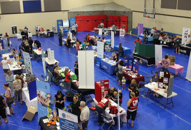 Local residents gather Tuesday night (Aug. 15) for Discovery Night. Forty businesses, services and vendors were on site meeting and interacting with the community.