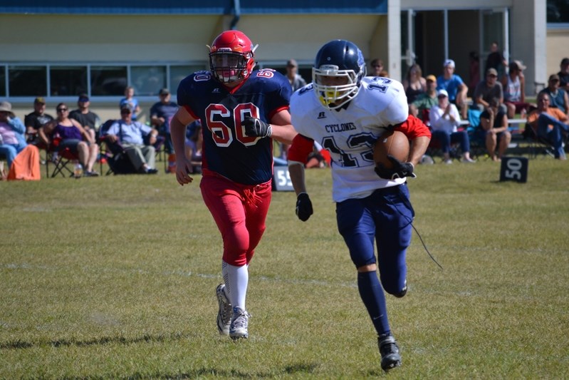 Joshua Koger-Ebbertz scampers 31 yards to the end zone during third quarter action between the Innisfail Cyclones and the Strathmore Badgers on Sept. 2.