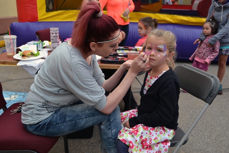 Five-year-old Emma Hansen has her face painted at the Innisfail Alliance Church&#8217;s Community BBQ &#038; Movie Night during the evening of Sept. 9.