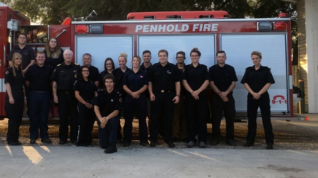 Penhold firefighter Danielle Meeres and Capt. Sean Pendergast are in the centre of the front row of this recent department photo.