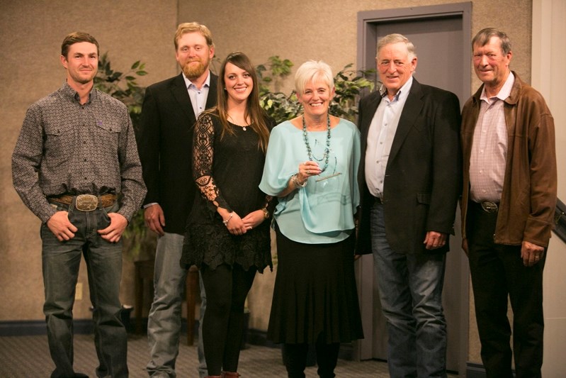 From left Brendyn Elliot, Colton Hamilton, Quinn Hamilton, Mabel Hamilton and Gavin Hamilton receive the Farm Family of the Year Award from Dr. Don Church of Red Deer County.