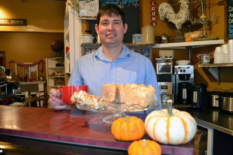 Joe Desjardins behind the counter at The Coffee Cottage, which he and his wife Jody have operated for the past nine years on 49 Avenue.