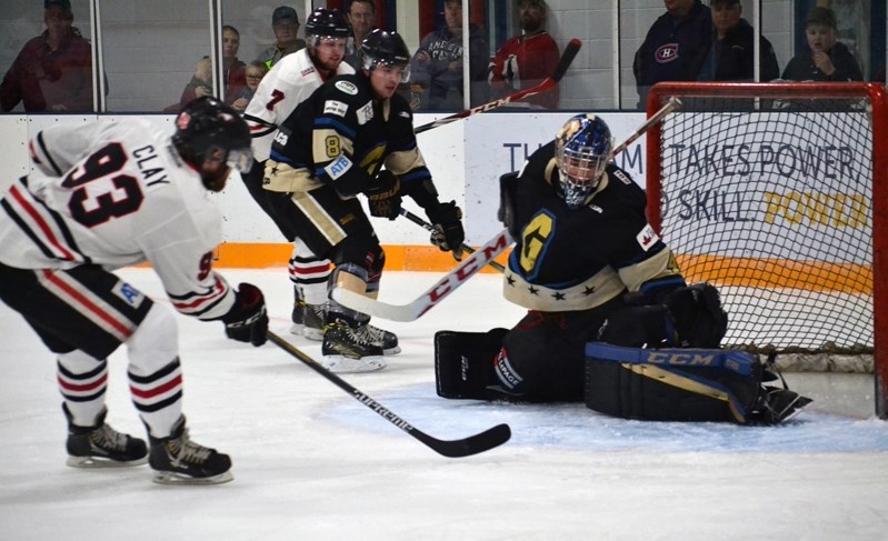 Lacombe Generals&#8217; netminder Steven Stanford stops the Eagles&#8217; Ty Clay from in close during second period action.