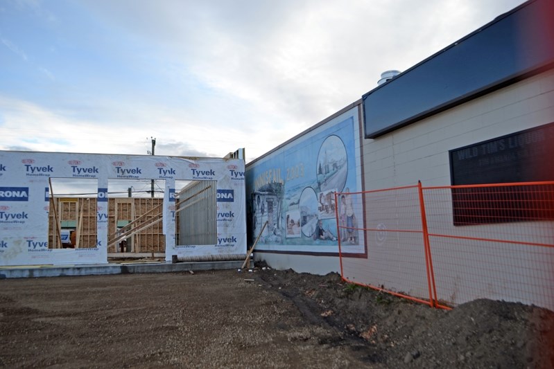 The full view of the centennial mural is now blocked from view by the commerical mall development at Main Street and 49 Avenue.