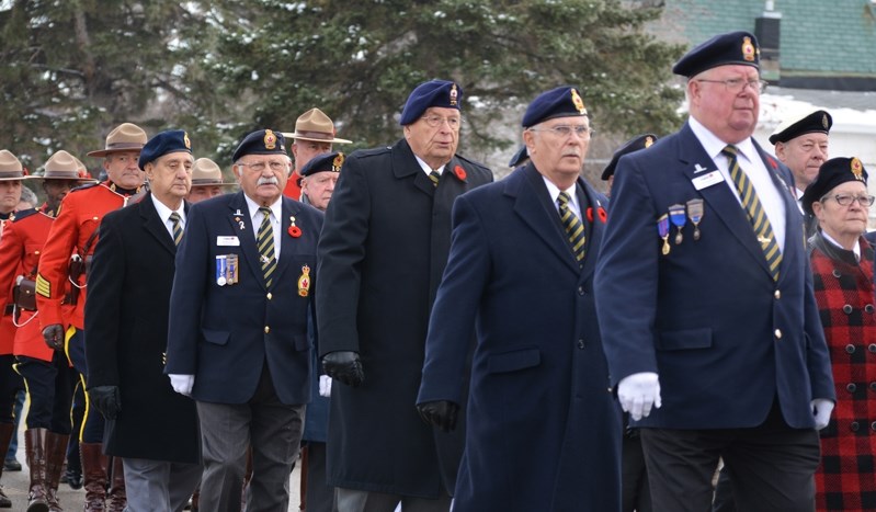 Innisfail and area veterans march to the cenotaph during the town&#8217;s Remembrance Day service on Saturday.