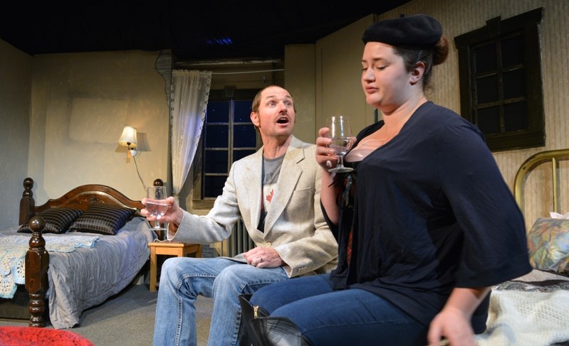 Innisfail Town Theatre actors Dave Kinsella, left, and McKinna Elliot rehearse a scene from ITT&#8217;s fall production A Bedfull of Foreigners during a recent tech